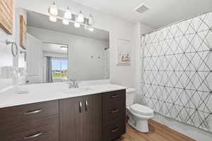 Bathroom featuring vanity and light wood finished floors