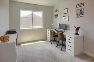 Bedroom /Office space #3 featuring light carpet and baseboards