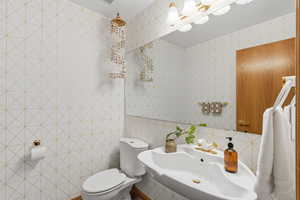 Bathroom with tile walls and toilet