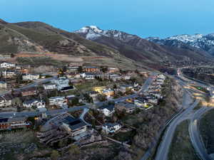 Aerial perspective of suburban area with a mountainous background