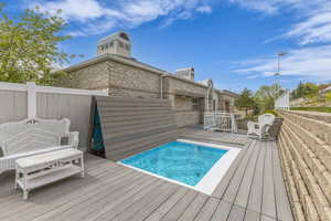 View of pool featuring a deck