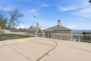 View of sport court featuring basketball hoop