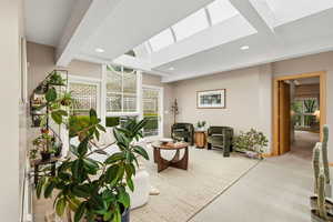 Lobby featuring beam ceiling and recessed lighting