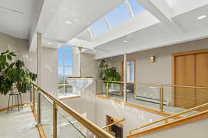 Corridor featuring baseboard heating and recessed lighting