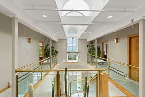 Hallway featuring baseboard heating and recessed lighting