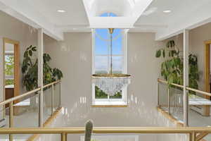 Balcony featuring a sunroom