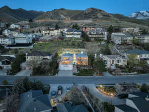 Aerial perspective of suburban area with a mountainous background