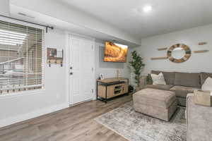 Living room featuring wood finished floors and baseboards