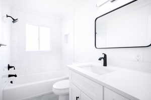 Full bathroom featuring vanity, bathtub / shower combination, and crown molding