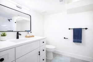 (virtual staging) Bathroom featuring vanity, a textured ceiling, and a shower
