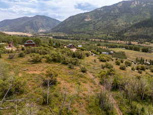 View of mountain backdrop with rural landscape