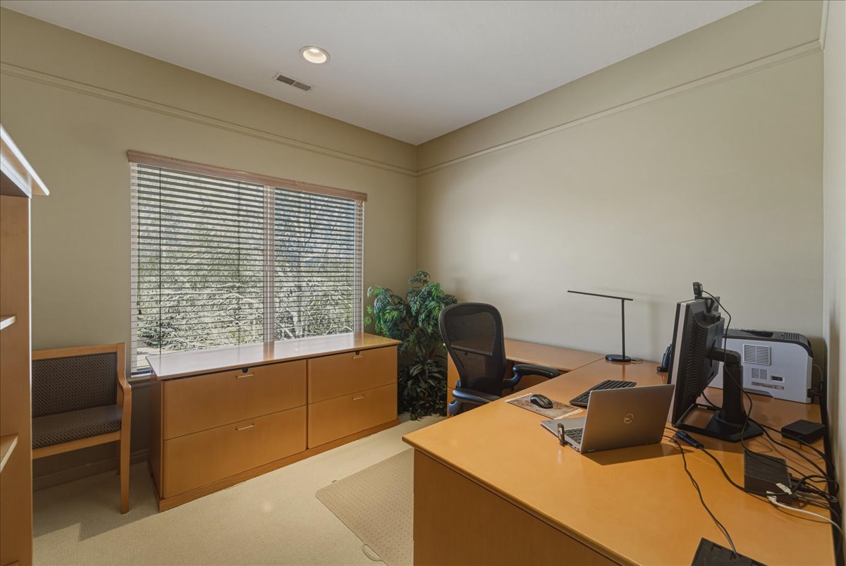 Home office featuring light colored carpet and recessed lighting
