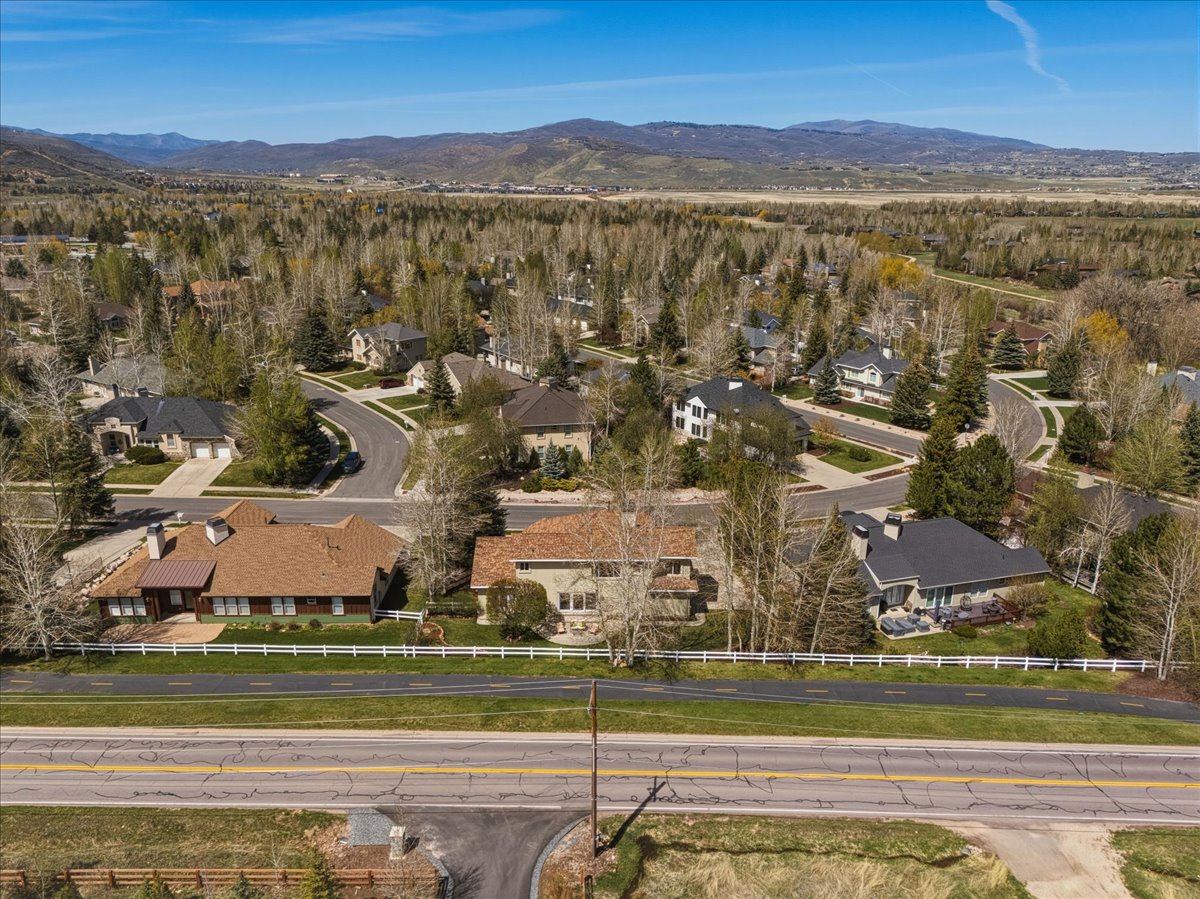 Aerial view of residential area featuring a mountainous background
