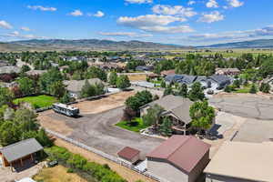 Aerial perspective of suburban area with a mountain backdrop