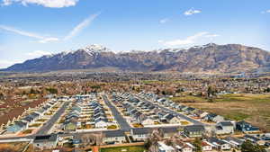 Aerial view of residential area featuring a mountain backdrop