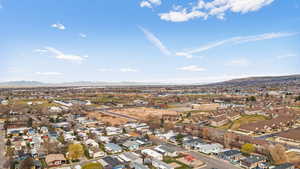 Aerial perspective of suburban area featuring a mountainous background