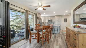 Dining area featuring recessed lighting, light wood-style floors, and ceiling fan