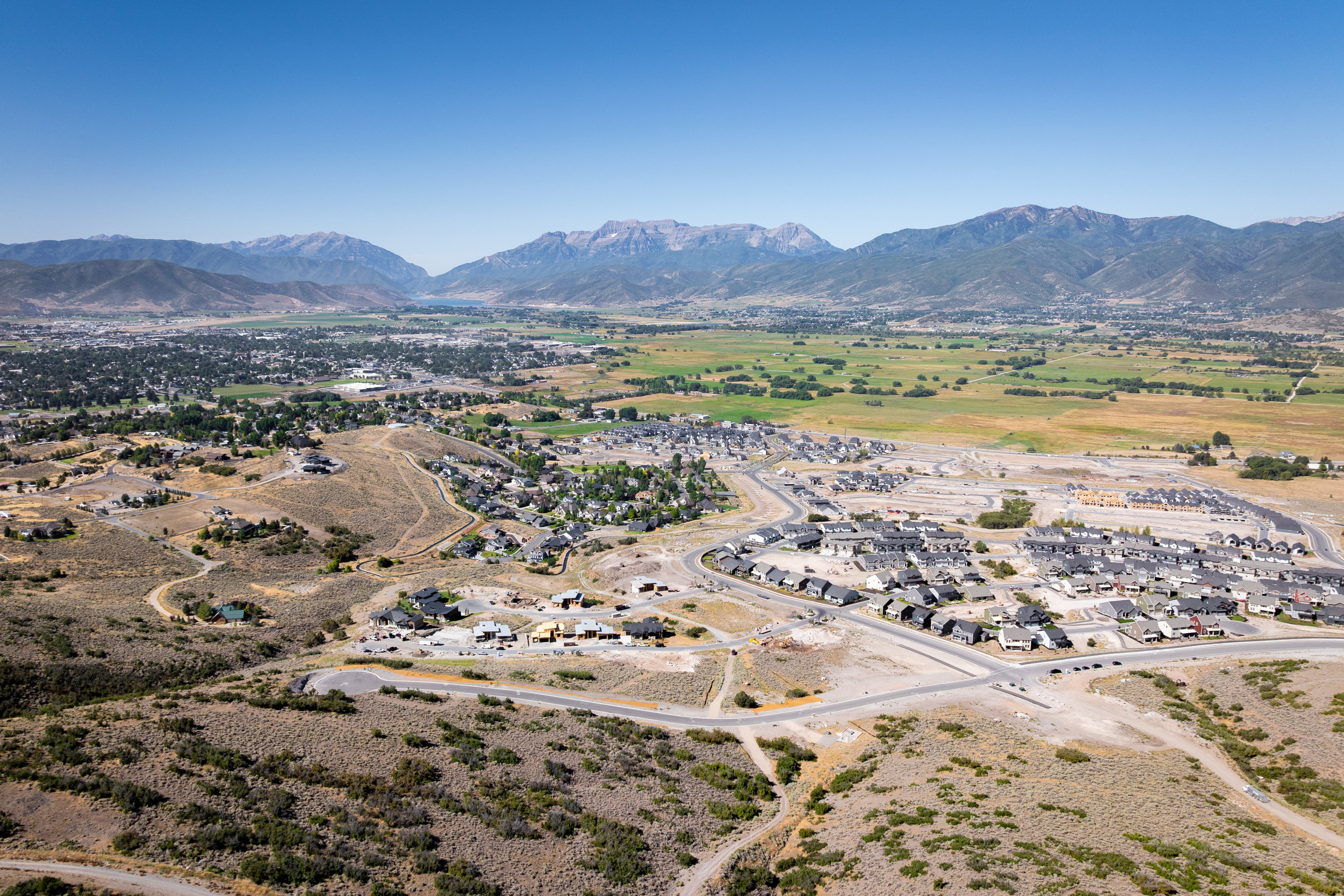 Aerial perspective of suburban area featuring a mountainous background