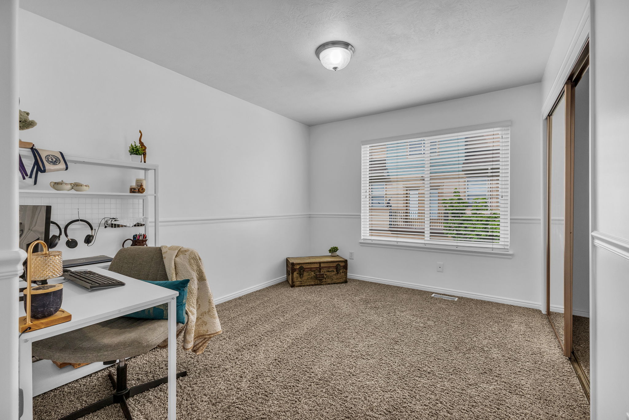 Office area with baseboards and carpet flooring