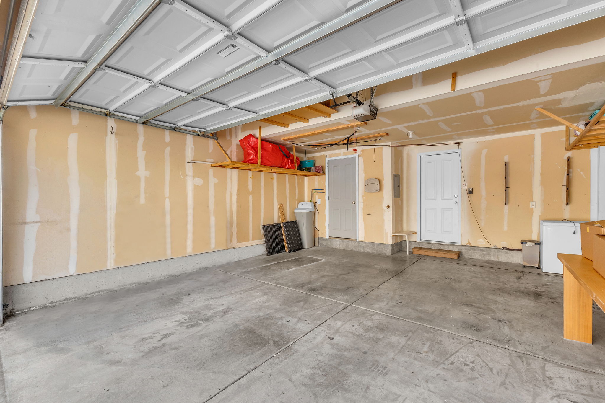Garage featuring white fridge