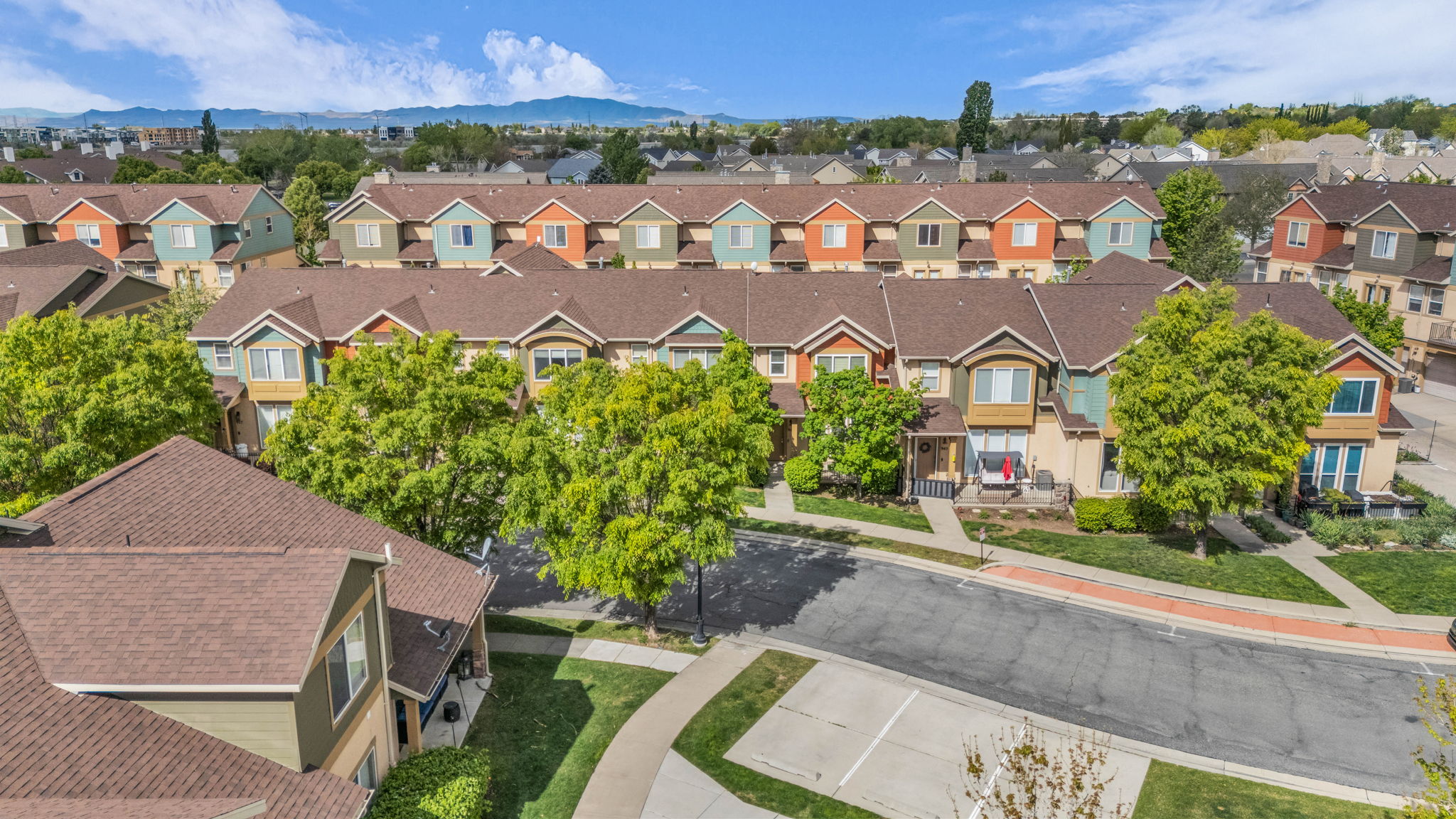 Aerial view of residential area featuring mountains