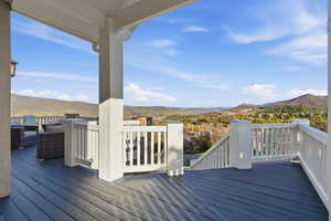 Wooden terrace with a mountain view and outdoor furniture