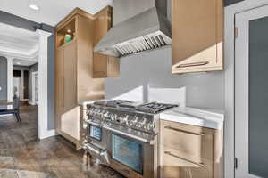 Kitchen featuring range with two ovens, dark wood-style floors, recessed lighting, glass insert cabinets, and crown molding