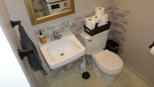 Bathroom with backsplash and tile walls