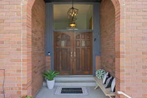 Doorway to property with brick siding
