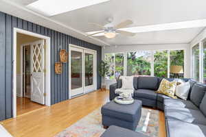 Sunroom with wood finished floors and plenty of natural light