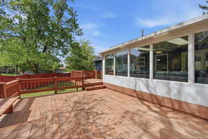 Large deck off of the sunroom, the backyard backs to a quiet cul-de-sac, offering unobstructed mountain views