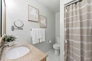 Primary Bathroom with a shower stall, vanity, and light marble finish floors