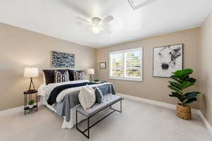 Bedroom with light colored carpet and ceiling fan