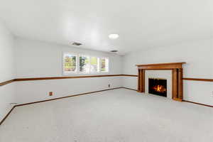 Basement family room with fireplace and wet bar.