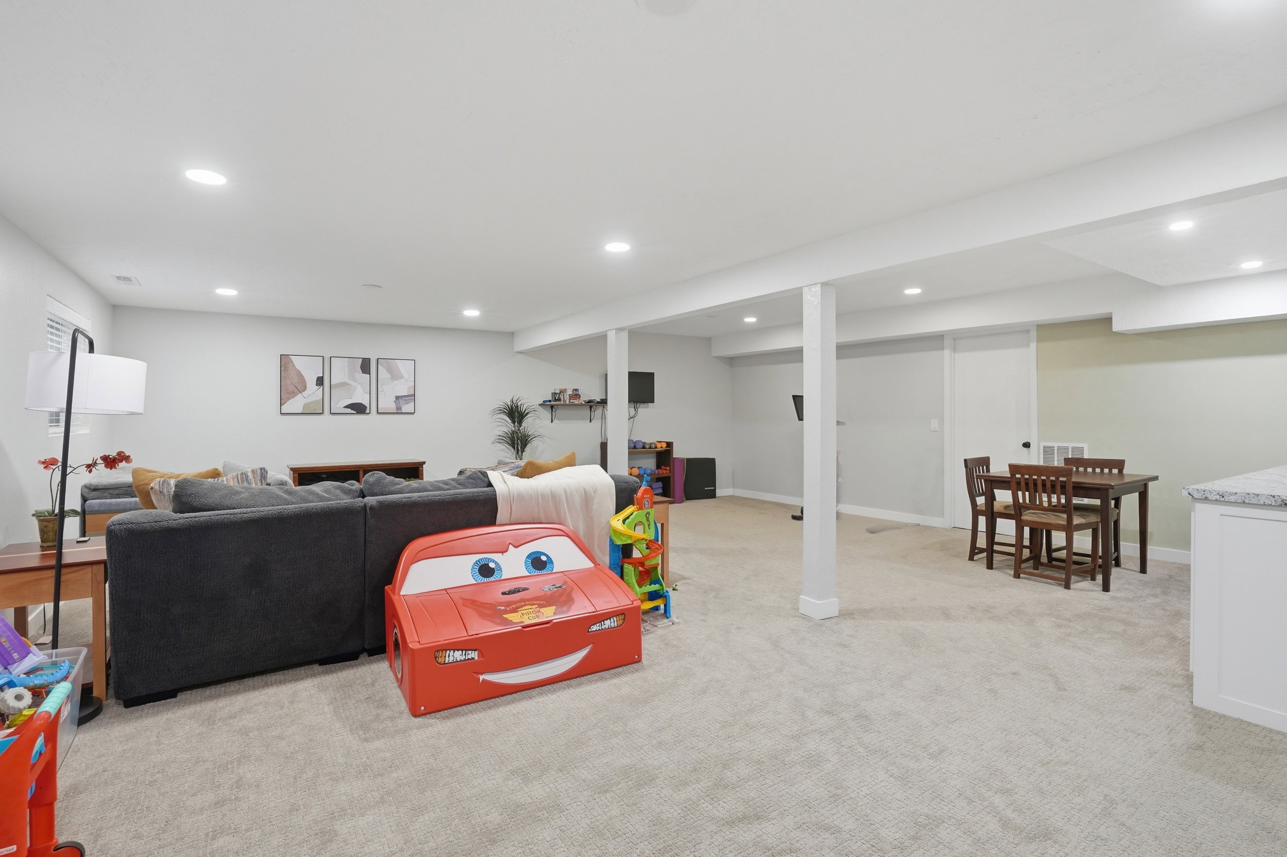 Recreation room featuring light colored carpet and recessed lighting