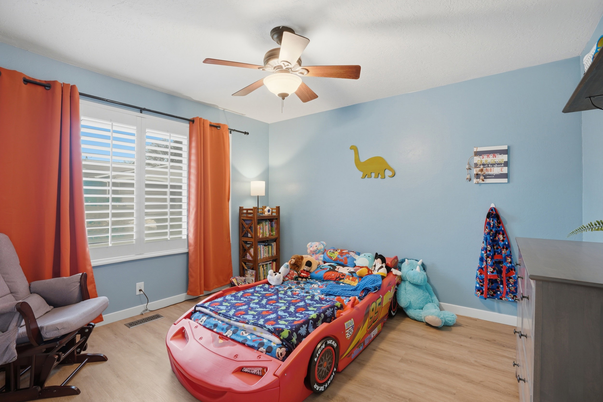 Bedroom featuring light wood-type flooring and a ceiling fan