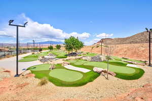 Surrounding community featuring a mountain view and a patio