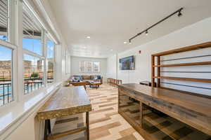 Dining space featuring track lighting