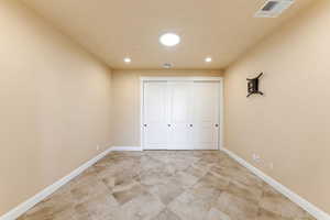 Unfurnished bedroom featuring a closet and recessed lighting