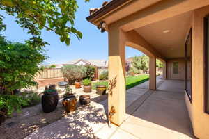 Fenced backyard with a patio area