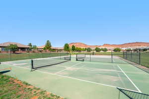 View of tennis court featuring a mountain view
