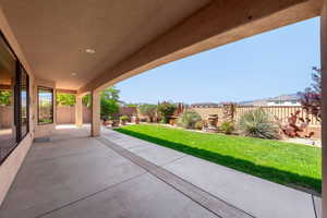 Fenced backyard featuring a patio