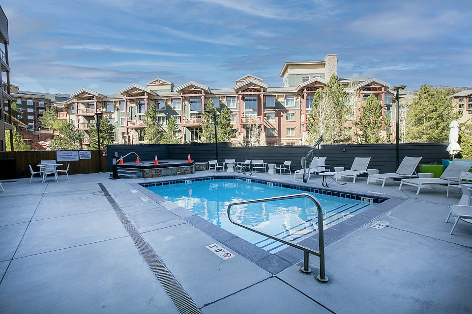 Community pool featuring a patio