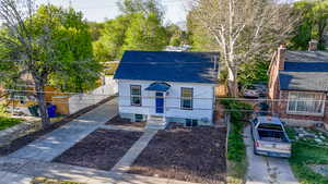 View of front facade featuring roof with shingles