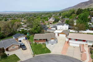 Aerial perspective of suburban area with a mountainous background