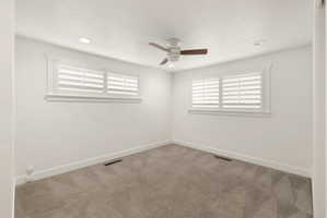 Fresh paint, ceiling fans, plantation shutters