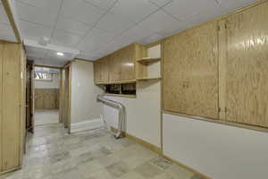 Laundry room featuring cabinet space and baseboards