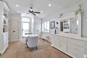 Bedroom featuring multiple closets, light colored carpet, recessed lighting, and a ceiling fan