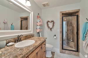 Full bathroom with a stall shower and vanity