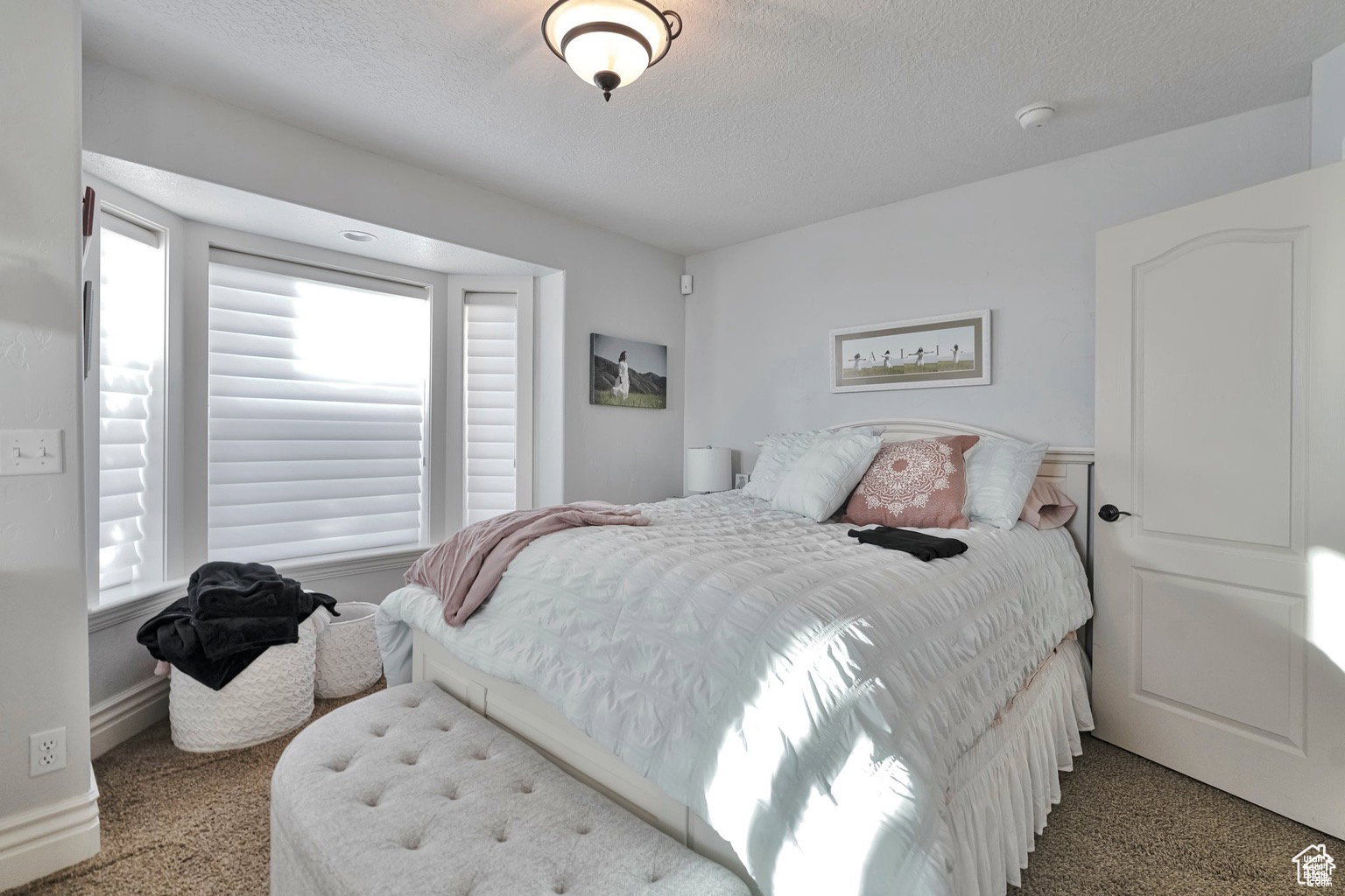 Bedroom with a textured ceiling
